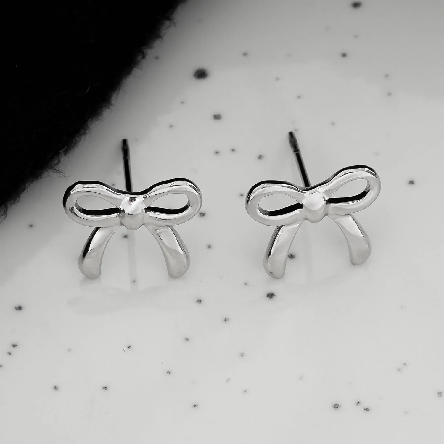 BOW: Silver Toned White Gold Bow Shaped Stud Earrings - Image 3