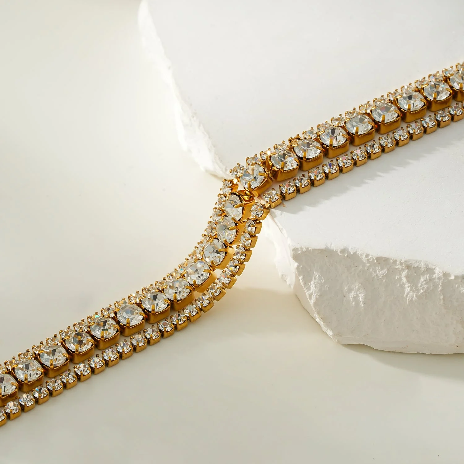 NANDAMA Gold: Triple Layered - Three-Row Zirconia (CZ) Tennis Bracelet with Bold Centerpiece. Stacked for Glamour. - Image 4