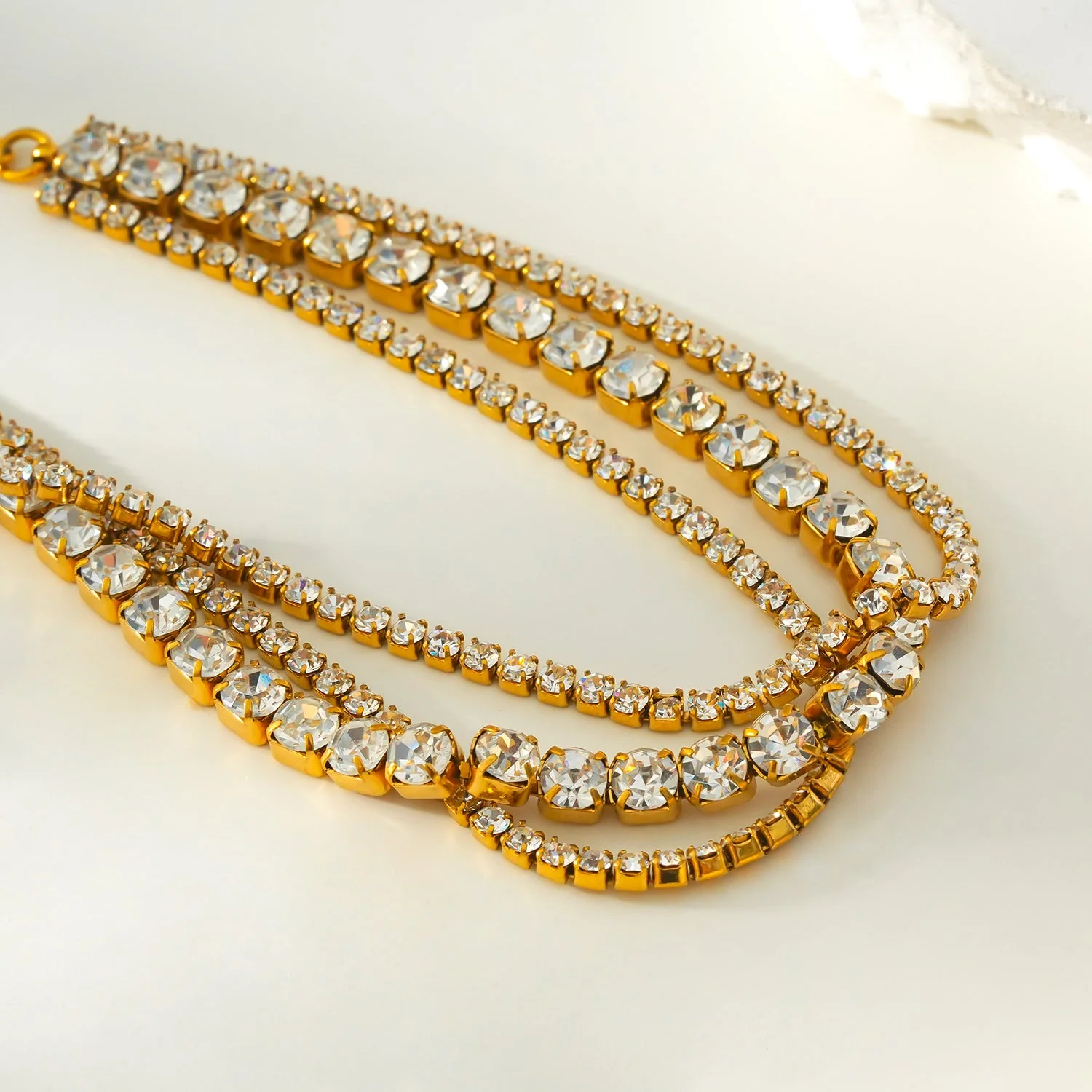 NANDAMA Gold: Triple Layered - Three-Row Zirconia (CZ) Tennis Bracelet with Bold Centerpiece. Stacked for Glamour. - Image 7