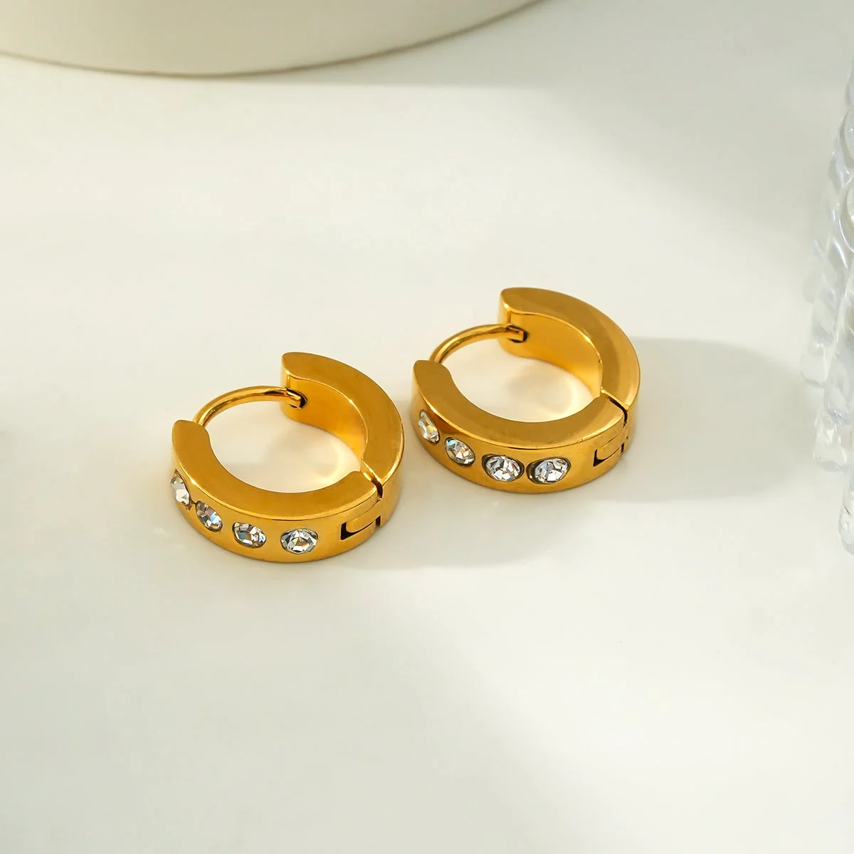 PAIA Gold: Wide Mini Hoop Earrings with an Array of Zirconia (CZ) Gemstones - Image 2