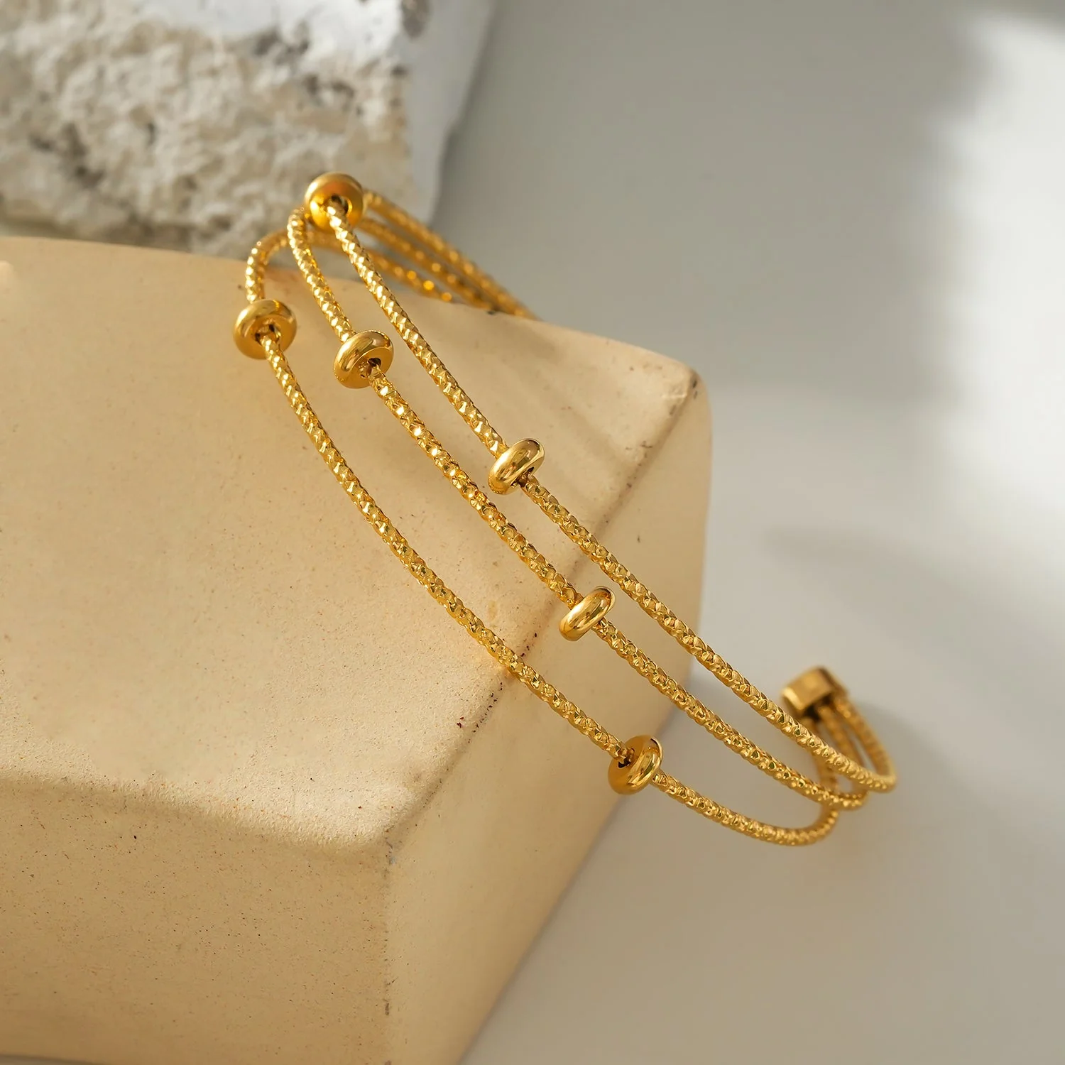 Style FARZIKA Gold: Triple Stacked Textured Beaded Bracelet - Image 3