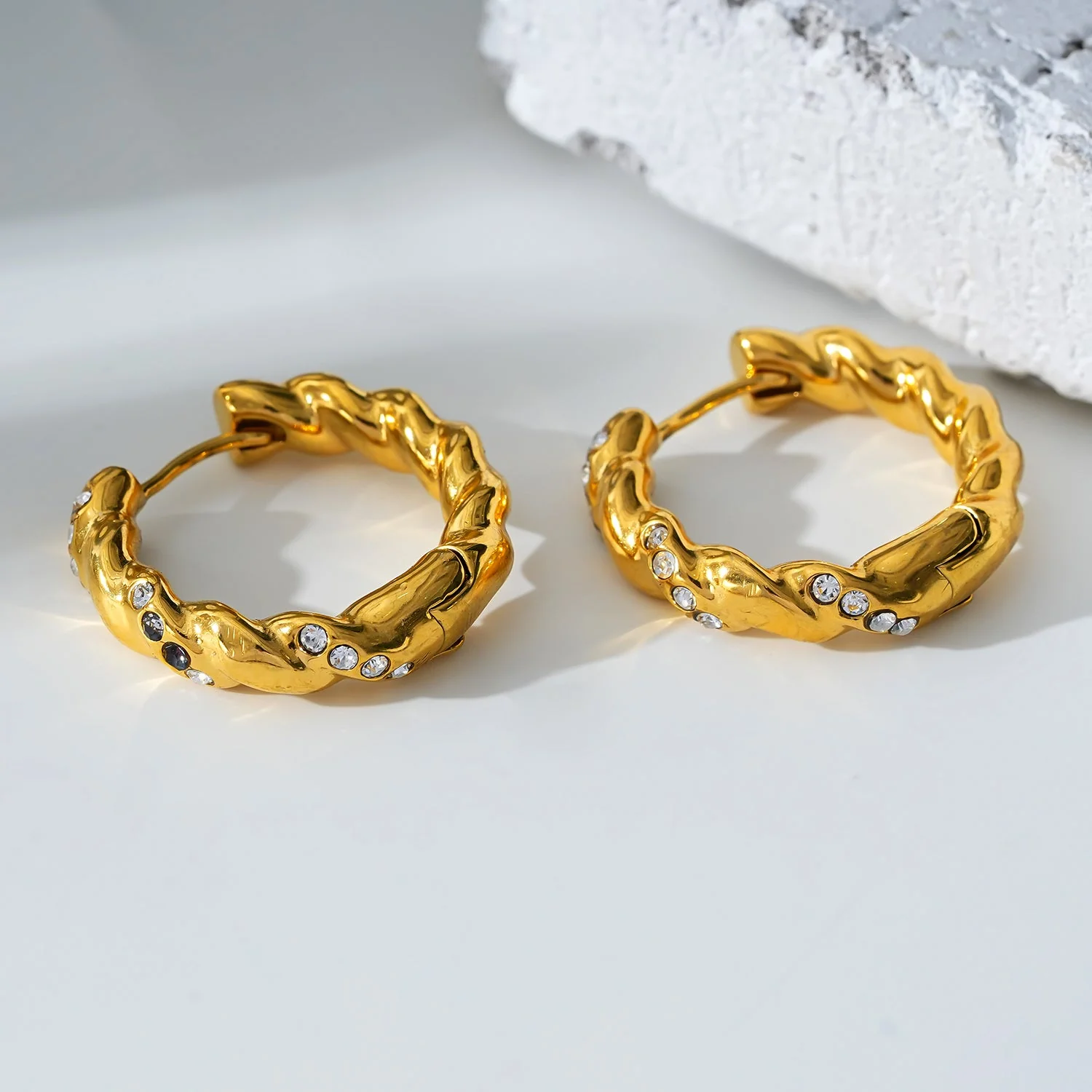 Style KAMENZ: Twisted Textured Hoop Earrings with Zirconia Embellishments. - Image 9