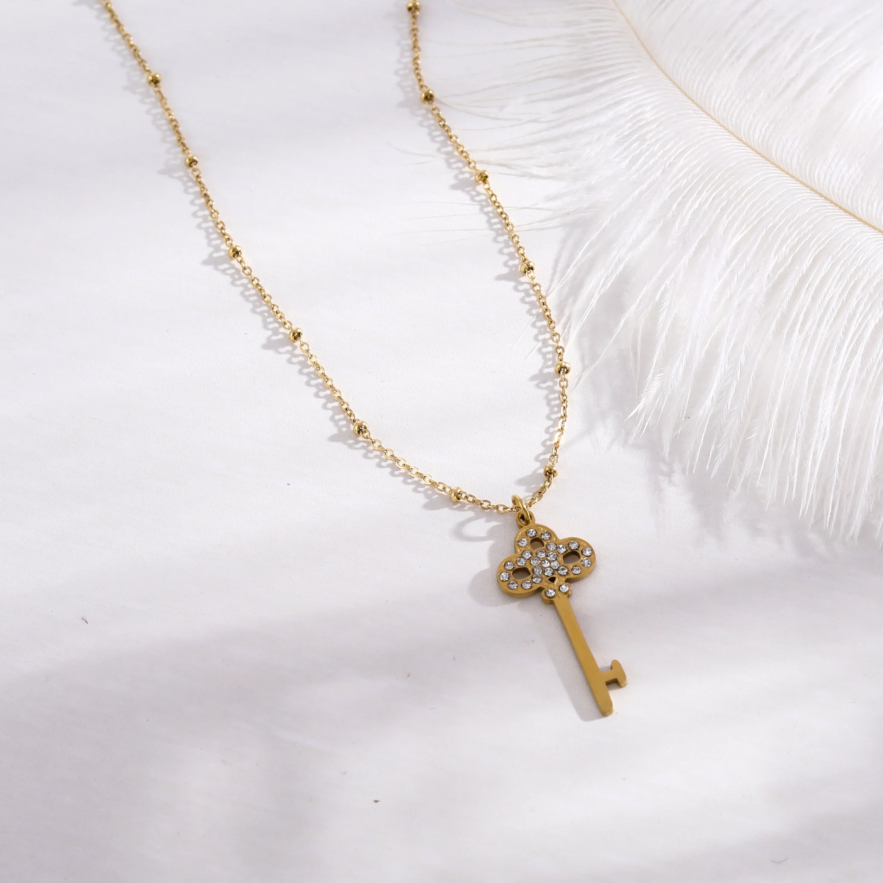 UNLOK Beaded Gold Chain with Zirconia Embellished Key Pendant